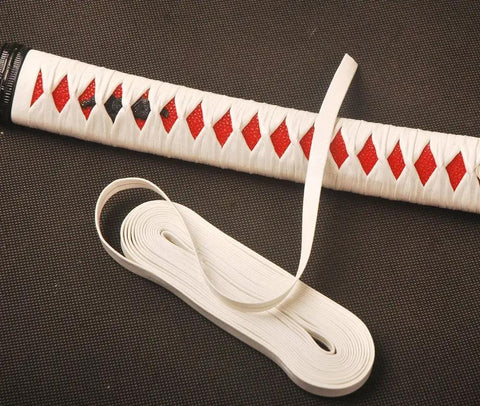 White 4.4 Yard Synthetic Leather Ito Tsukamaki Sageo Wrap Cord next to wrapped katana handle with red details
