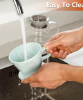 Person cleaning Travel Ready Ceramic Pour Over Coffee Dripper With Three Hole Flat Bottom Cone For On The Go Brewing, No Fuss Handmade Ceramic Brew Tool For Travel Camping Office Or Home Green under running water at kitchen sink.
