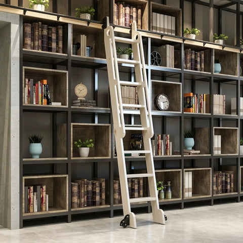 Tough As Nails Sliding Barn Door Hardware Kit With Ridiculously Smooth Rolling Steel Tube Rail And Heavy Duty Floor Casters For Indoor Loft Home Makeover with a white indoor ladder beside a modern bookshelf.