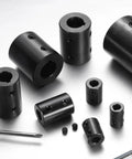 Various black oxide coated rigid shaft couplings, including Rigid Shaft Coupling 1 Inch Bore 2 Inch OD 3 Inch Long with 4 set screws.