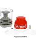 ARES bearing packer kit: clear plastic reservoir, red cap, two white conical funnels, metal screw.