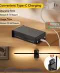 Heavy Duty Battery Operated Wall Sconces Set Of Two With Remote Control And 10000 Mah Rechargeable Battery Pack charging setup on a wooden table.