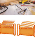 Built Tough Adjustable Woodworking Featherboard Rock Solid Kickback Shield Stackable Router Table And Table Saw Push Stick For Top Shelf Workshop Projects Tan Color on a workbench.