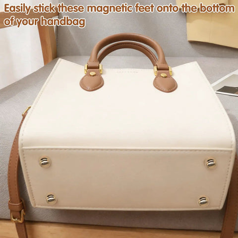 Magnetic Purse Feet For Handbags 4 Pack No Hole Design Metal Bag Feet Protectors shown installed on a beige handbag bottom