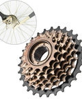 7 Speed Screw On Freewheel For Mountain Bikes Beefy Steel Construction Smooth Quiet Shifting Fits Threaded Hubs On Mountain Hybrid And Road Bikes Easy Indexing With 7 Speed Shifters, showing detailed gear teeth and cassette attachment to bike wheel.