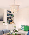 Wood Beaded Farmhouse Chandelier With White Finish And Adjustable Cord in living room setting