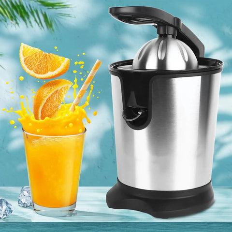 Electric Citrus Juicer With Stainless Steel Pulp Control And Large Volume Capacity next to a glass of fresh orange juice.