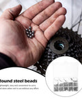 580-Piece Stainless Steel Bearing Balls Kit 1.0mm Through 10.0mm Portable Precision Balls For Mechanical And Industrial Use, Wear-Resistant, Easy-Storage Assortment Built For DIYers And Pros In The Shop. Hand holding steel balls near a bike gear, with storage case