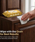 XL Wood Furniture Cleaner Wipes 8X10 Inch 70 Count used on wood cabinet surface, hand wiping for polished finish.