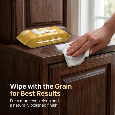 XL Wood Furniture Cleaner Wipes 8X10 Inch 70 Count used on wood cabinet surface, hand wiping for polished finish.