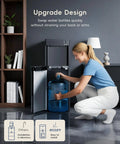 Woman loading 5 gallon bottle into 4 In 1 Water Dispenser With Ice Maker, Hot And Cold Water Cooler, Bottom Loading, Eco Mode.