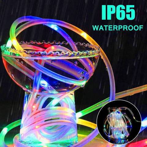 Colorful Outdoor Battery Operated LED Rope Lights 40 Ft With 120 LEDs wrapped around glass, showcasing IP65 waterproof feature.