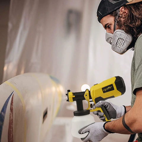 Person using Brushless HVLP Cordless Paint Sprayer 1200ML Cup With 4 Nozzles And 3 Spray Patterns That Works With 20V Batteries