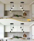 Kitchen view displaying Three Light Pendant Light With Clear Glass Shades, Matte Black Finish, Adjustable Height Industrial Retro Ceiling Hanging Lamp For Your Kitchen Island And Bedroom, E26 Base Compatible, Bulb Not Included, No Fuss in illuminated and non-illuminated state.