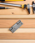 Self-Closing Hydraulic Door Hinges For Wood Doors With 90 Degree Positioning And Hidden Design, Stainless steel hinge on wood surface