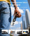 Person holding Fun Shot Magnetic Phone Grip Turns Your Smartphone Into a DSLR Style Shooter outdoors, ergonomic handle visible