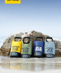 Four colorful dry bags on the beach with Waterproof Dry Bag With Phone Pouch And Floating Roll Top Backpack 10L Green visible.