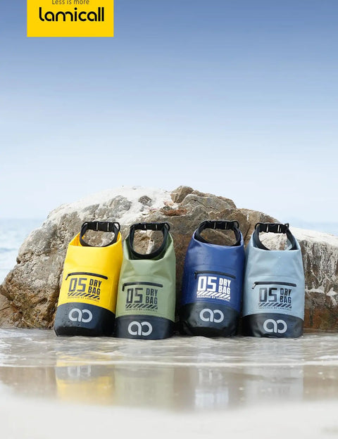 Four colorful dry bags on the beach with Waterproof Dry Bag With Phone Pouch And Floating Roll Top Backpack 10L Green visible.