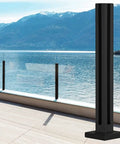 Black Steel Glass Railing Kit designed for wide decks with clear sight lines, showcasing adjustable height mounting in outdoor setting.