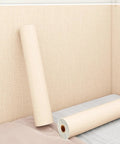 Peel And Stick Wallpaper Featuring Solid Thermal Insulation And Acoustic Linen Texture No Sweat Install Removable Wallpaper To Vibe Up Any Bedroom Or Ceiling, showcasing a roll against a textured wall.