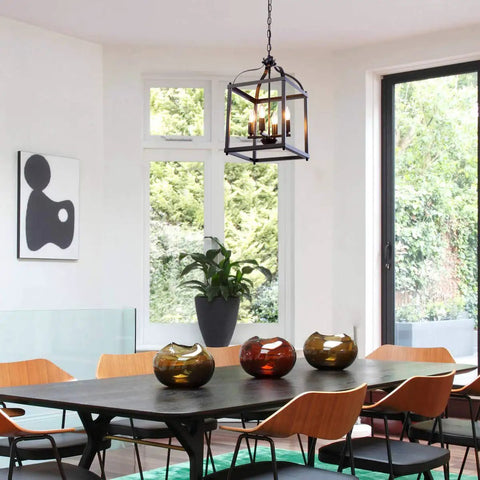 Industrial Pendant Light With Classic Black Metal Cage For Farmhouse And Modern Homes hanging above dining table.