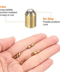 Top Shelf Heavy Duty Brass Ball Point Spring Plunger Assortment Kit with brass plungers displayed in hand, highlighting their stability and design.