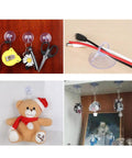 Super Strong Suction Cup Hooks For Bathroom Wall 10 Pack holding scissors, tape measure, and toys on smooth surfaces.