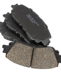 Front And Rear Ceramic Brake Pad Set With Hardware For Toyota shown in stack, highlighting pad material and design.
