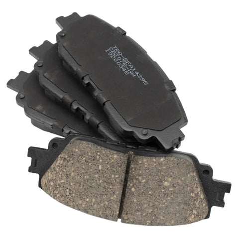Front And Rear Ceramic Brake Pad Set With Hardware For Toyota shown in stack, highlighting pad material and design.