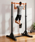 Beast Mode Ready Heavy Duty Free Standing Pull Up Bar Station with H Frame in home gym setting with man exercising