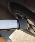 Kickass Waterproof Silicone EV Charger Plug Cover For Tesla Nacs Connector with black and silver design, showcasing fit on charger.