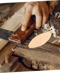 Craftsman using 100 PC Wood Biscuits For Woodworking Pro Grade Slotting And Plywood Joinery Tool on wooden board