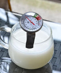 Instant Read 2-Inch Dial Thermometer For Coffee Drinks And Milk Foam measuring milk temperature in glass cup