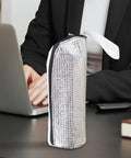 Insulated Bottle Cooler Bag and Thermal Tote with Triple Layer Insulation on desk, silvery exterior for moisture blocking.