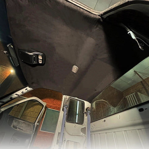 Suede headliner fabric with foam backing, black, installed on vehicle roof interior