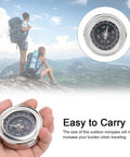 Mini Stainless Steel Compass For Camping And Hiking, Portable Survival Navigation Tool in hand, outdoor background