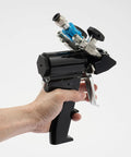 Heavy Duty Polyurethane Foam Spray Gun With Air Purge Self Cleaning PU Foaming Tool held in hand, showcasing cast iron frame and nozzle.