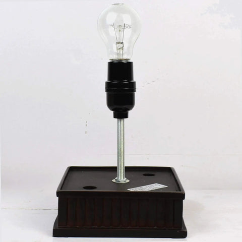 Base of Tiffany Style Table Lamp With Iris Flower Butterfly Stained Glass on flat surface without shade
