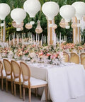 Elegant wedding setup with 10 Pack White Hanging Hot Air Balloon Paper Lanterns 12 Inch Party Ready DIY Decor, reusable and easy to assemble.