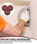 Pro Grade Drywall Corner Sander Kit With 24 Reusable 9 Inch Hook And Loop Discs in use on wall corner, grip detail visible.