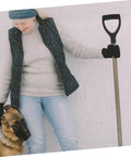 Woman holding Replacement Garden Shovel Handle With Plastic Grip Universal Spade Handle for Hand Shovels, standing with dog