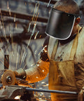 Man using Replacement Face Shield Lens 15.5 x 8 Inches Black Protective Safety Shield, Durable Polycarbonate for welding safety