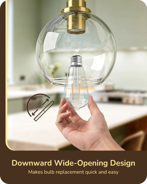 Close-up of Two Pack Slick Vintage Pendant Lights With Clear Glass Globes And Gleaming Gold Canopies Adjustable Drop Length design for easy bulb replacement.