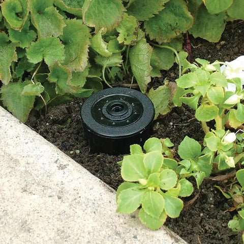 Realistic Sprinkler Key Hider Hidden Safe for Keys, Cash, and Small Essentials installed in garden resembling real sprinkler head