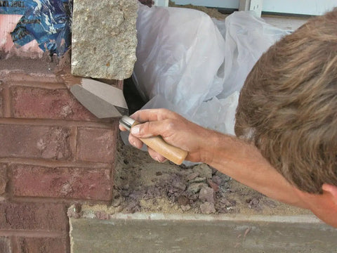 Person using Pointing Trowel 7 Inch By 3 Inch With Wooden Handle For Masonry Cement And Concrete Finishing Pro Quality For DIY Projects