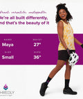 Woman wearing 2.0 Padded High Rise Biker Shorts For Women With Waistband Free Design And Softer Compression, holding helmet