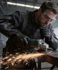A worker using a grinder wearing Heavy Duty 22 Inch Black Latex Gloves Chemical Resistant Rubber Gauntlets for Industrial Work.