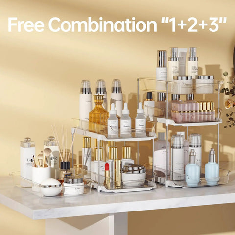 Total Game Changer Clear Three Tier Under Sink Organizer Two Pack Smooth Glide Adjustable Stackable Storage Bins With Moveable Dividers on display with skincare bottles.