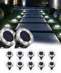12 Pack Solar Ground Lights Low Profile Flat Disc LED Pathway Lights Outdoor Waterproof Mower Safe For Garden Patio Yard Driveway 2.2 Inch Cold White Lighting illuminating a garden path at night