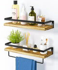Wall mounted shelves with wooden boards and black metal supports holding toiletries and decor items.